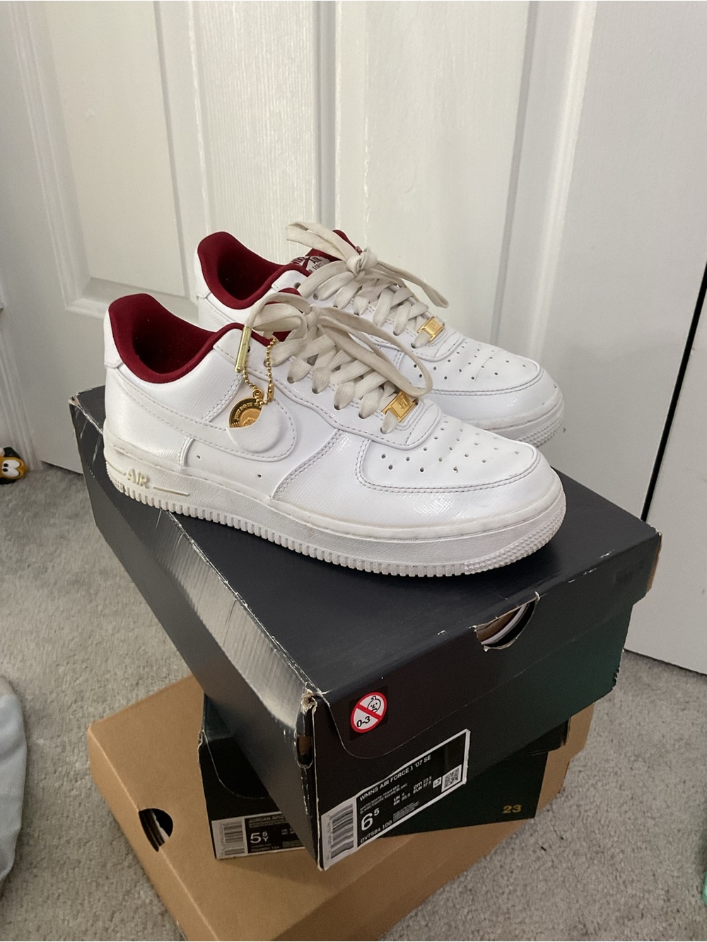 Nike Women's White Sneakers with Burgundy Lining and Gold Accents